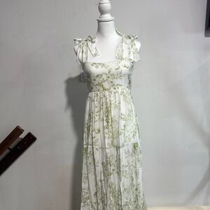 Green long dress with one bow on each side and prints of fruits